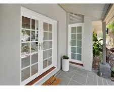 Modern entry door and glass facade
